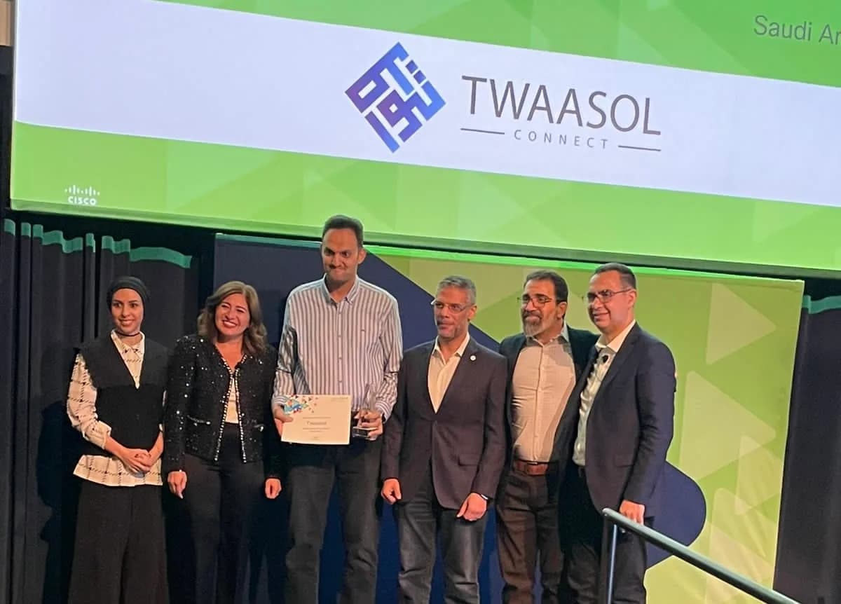 The Twaasol Connect team accepting the API Innovator of the Year award on stage at the Cisco event in Saudi Arabia.